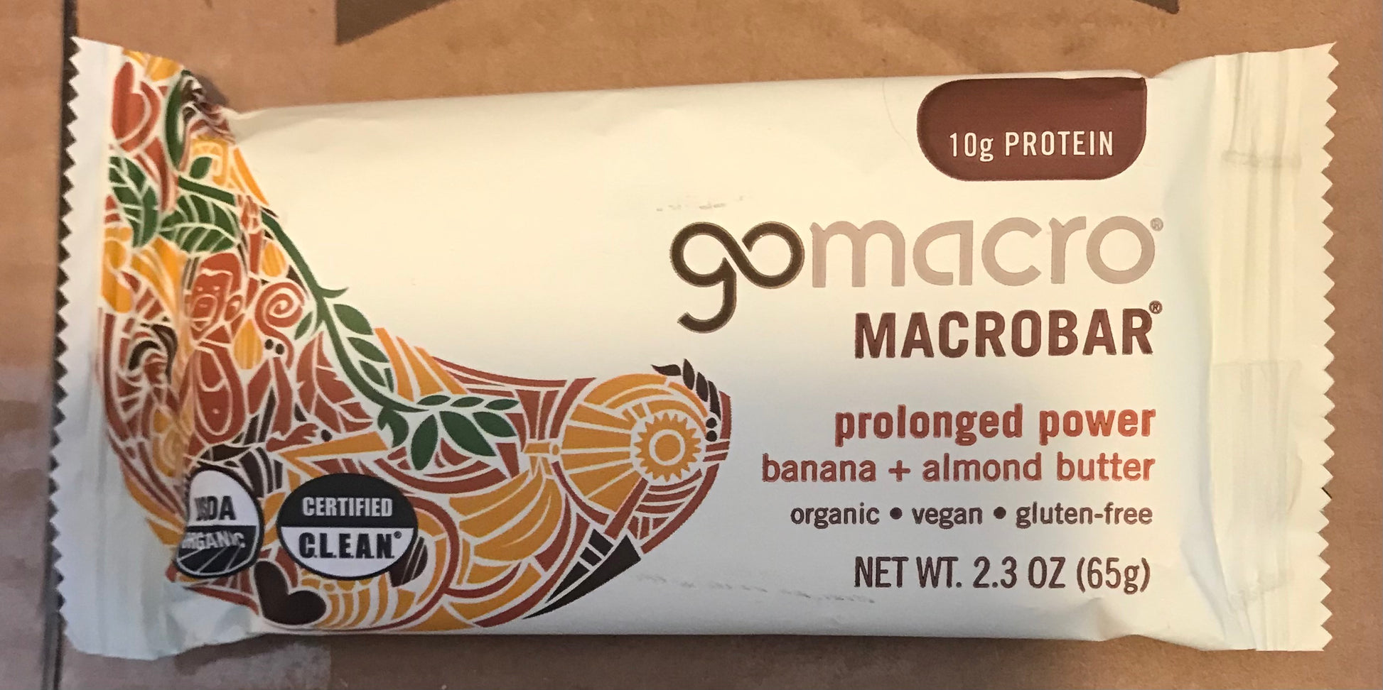 gomacro Macrobar packaging with banana and almond butter flavor on a brown background